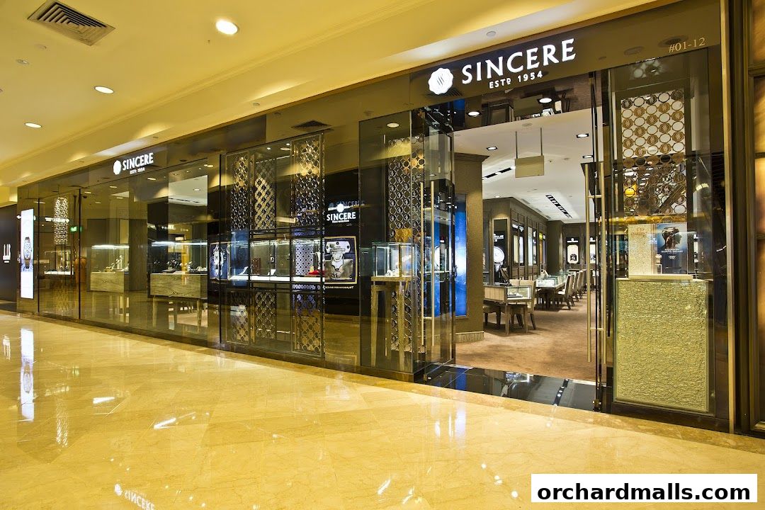Exterior view of Sincere Fine Watches, a luxury watch retailer, showcasing its elegant storefront and interior displays.