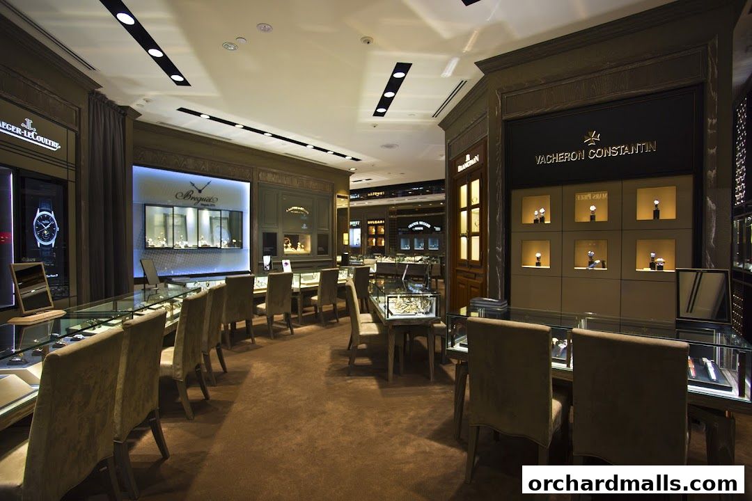 Interior view of a luxury watch store showcasing various brands and timepieces.