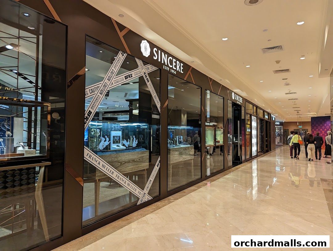 The exterior of Sincere Fine Watches, a luxury watch retailer, with display windows showcasing watches.