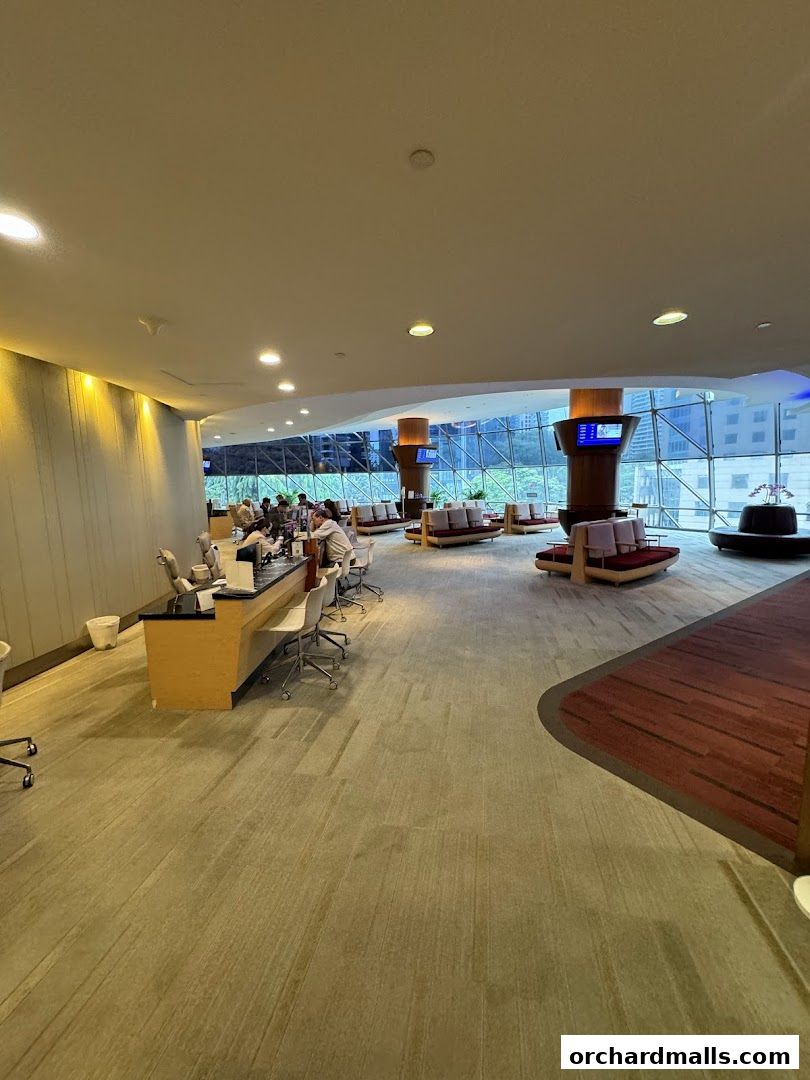 Interior of the Singapore Airlines Service Centre with seating areas and a reception desk.