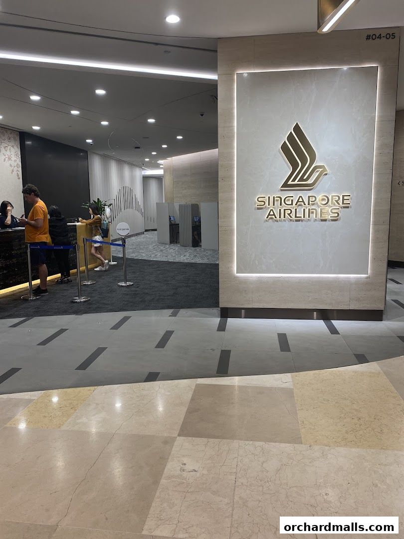 The Singapore Airlines Service Centre ION features a prominent logo and a reception area with staff and customers.
