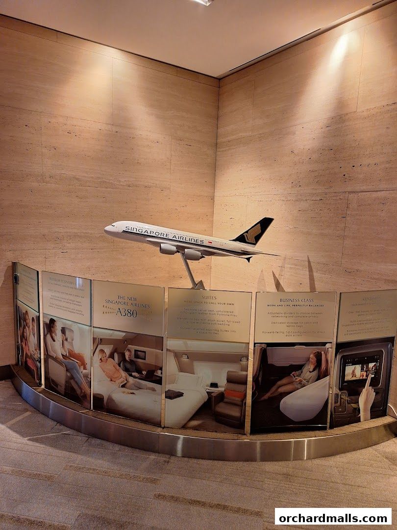 A Singapore Airlines A380 model displayed with information panels about cabin classes.