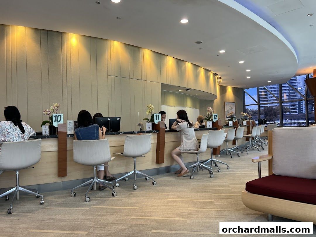 Interior of Singapore Airlines Service Centre with staff and customers at counters.