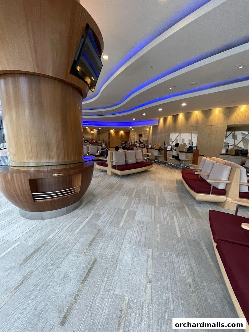 Interior of Singapore Airlines Service Centre with modern seating and blue accent lighting.