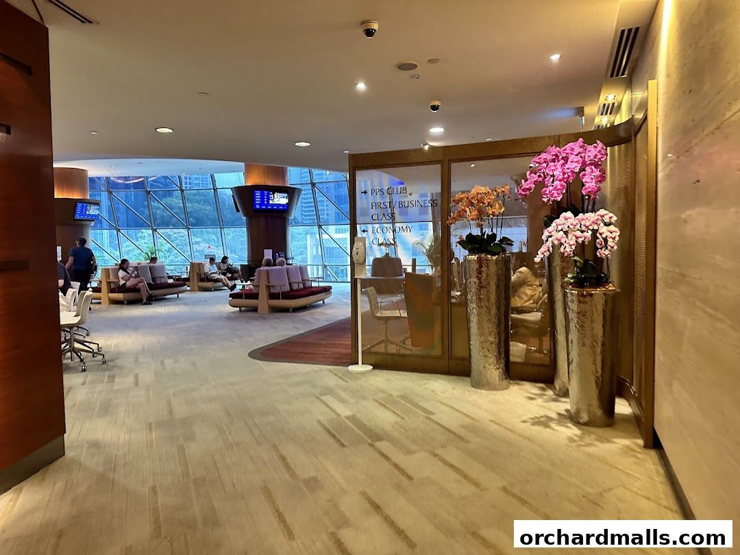 Interior of the Singapore Airlines Service Centre with seating areas and floral arrangements.