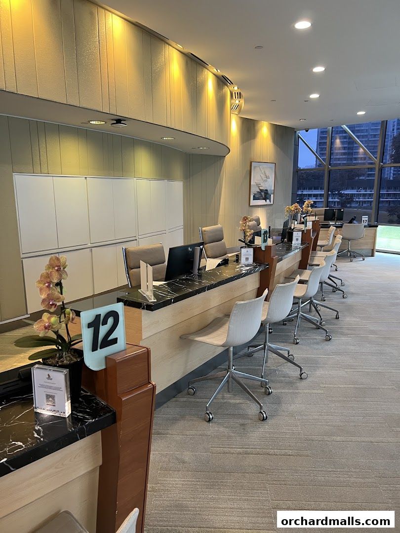Interior of the Singapore Airlines Service Centre with a long counter and chairs.