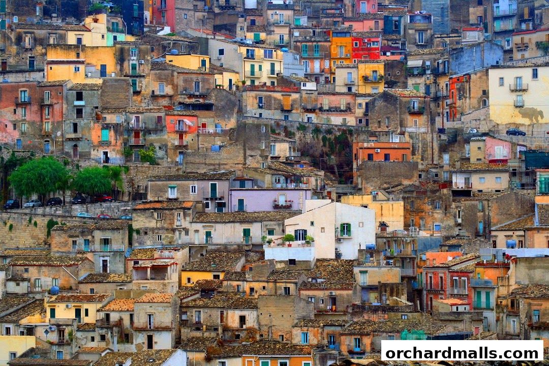 A dense cityscape of colorful buildings cascading down a hillside.