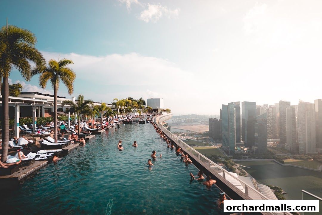People relax and swim in a rooftop infinity pool with a stunning city skyline view.
