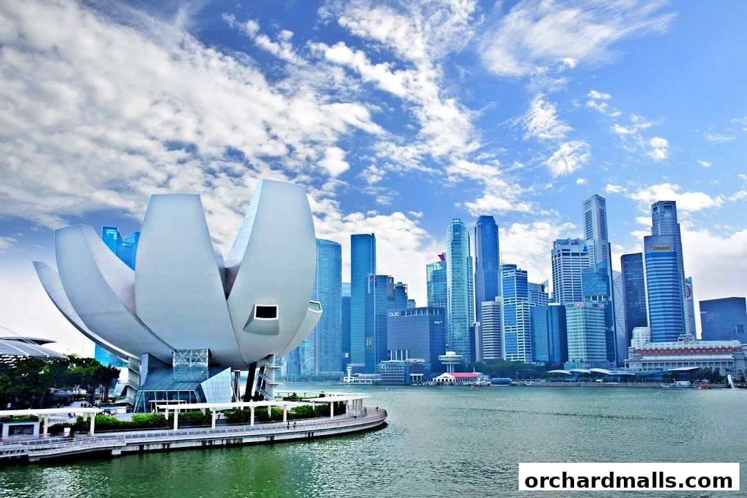 The ArtScience Museum in Singapore with the city skyline in the background.