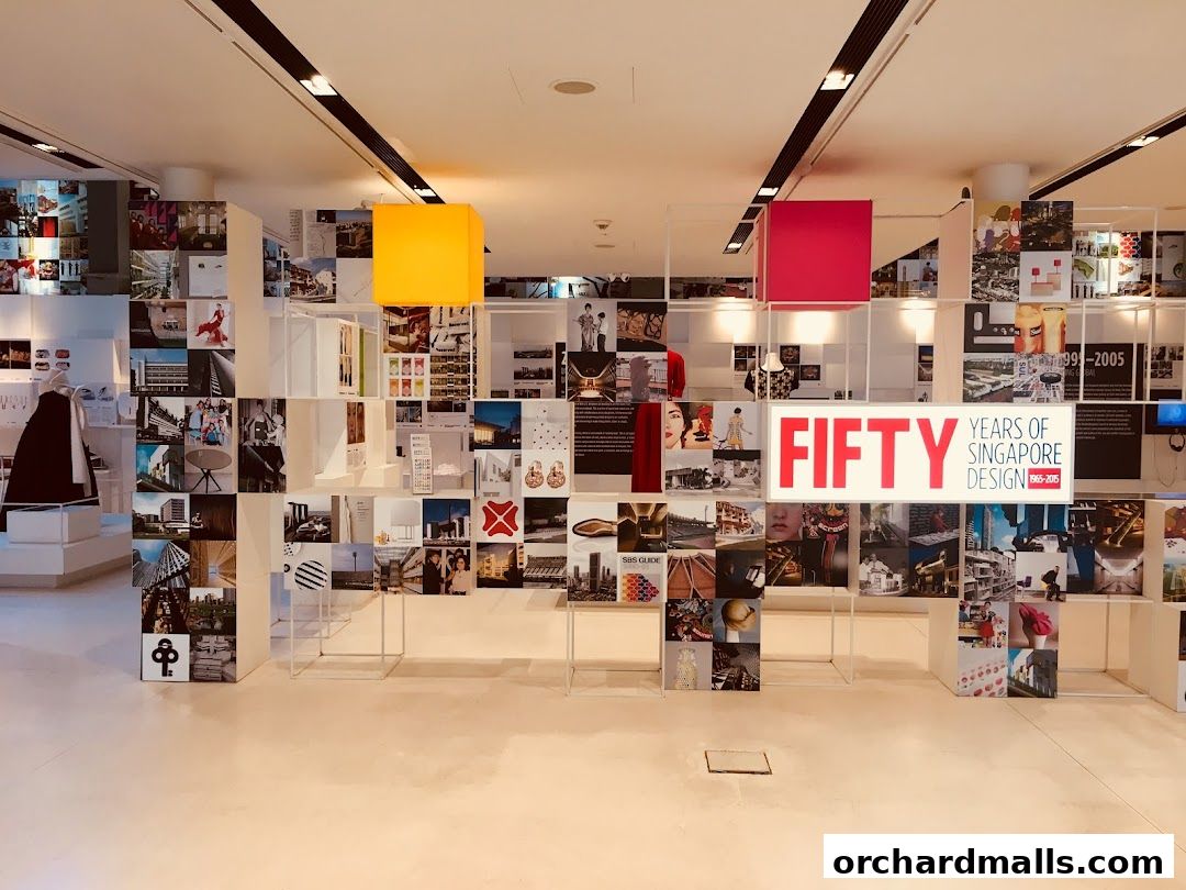 An exhibition showcasing fifty years of Singaporean design with various images and displays.