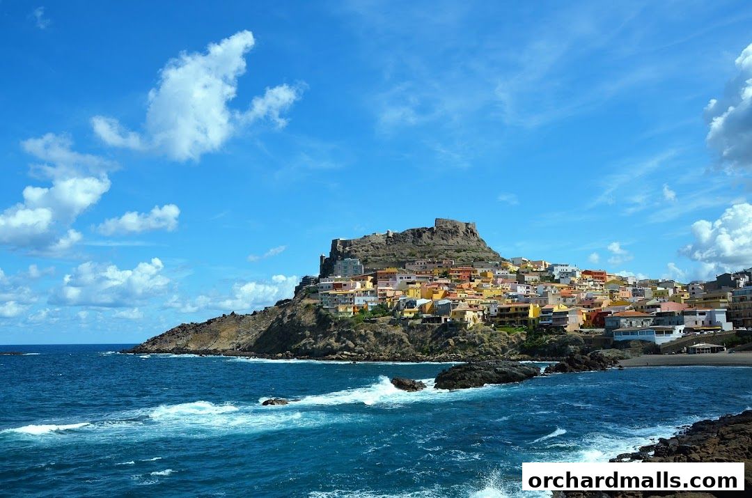 A picturesque coastal town with colorful buildings perched on a hill overlooking the sea.