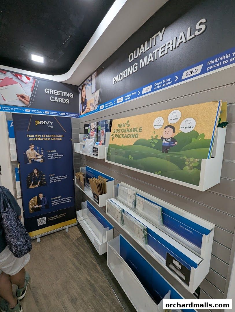 Interior view of a Singapore Post branch showcasing greeting cards and sustainable packaging materials.