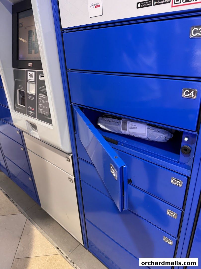 Singapore Post parcel lockers with one compartment open showing a package.