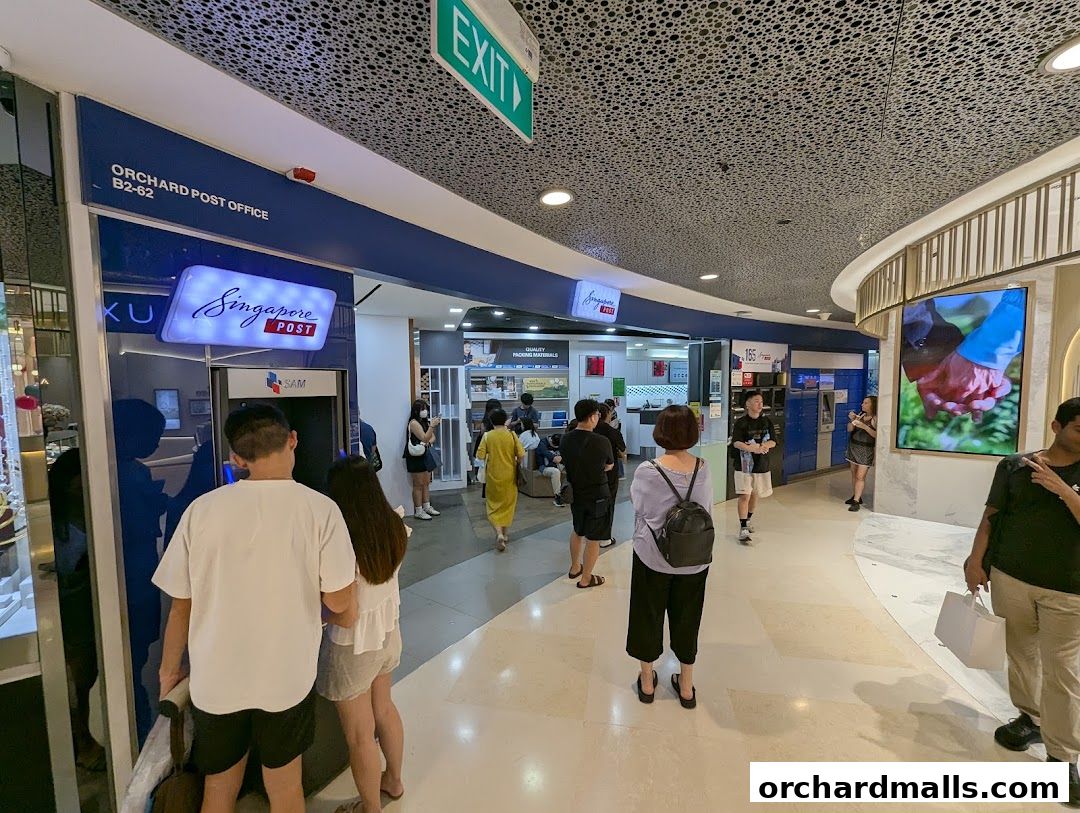 People are queuing at the Singapore Post Orchard Branch, with a SAM machine visible.