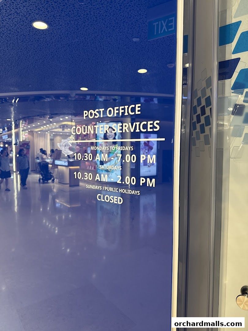 The entrance to Singapore Post's Orchard Branch, displaying counter services and operating hours.