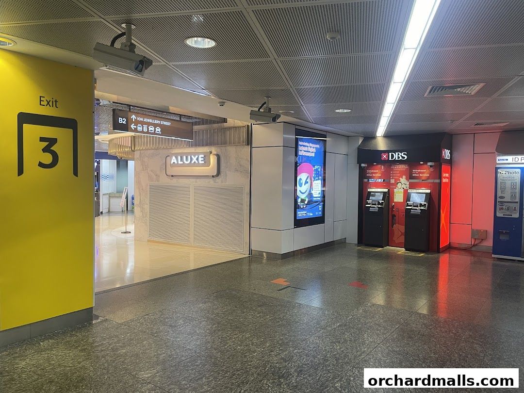 Exterior view of Singapore Post - Orchard Branch with ATMs and signage.
