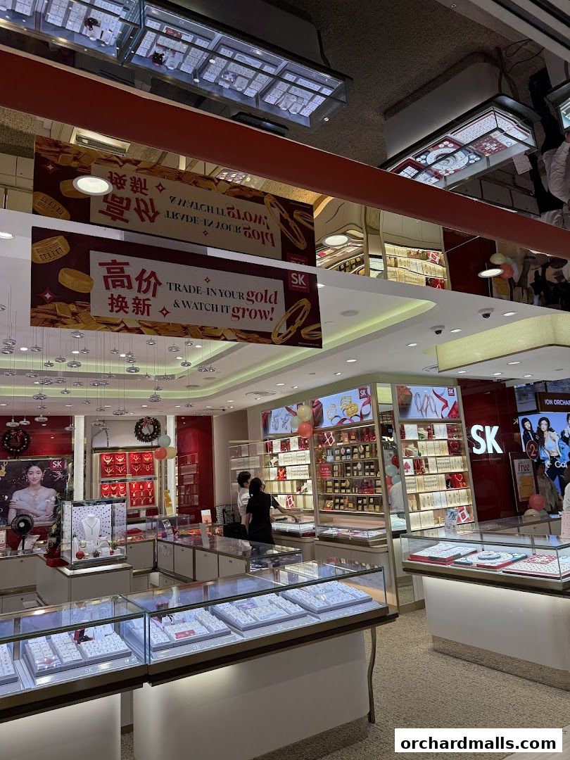 Interior of a jewelry store with display cases filled with necklaces, rings, and bracelets.
