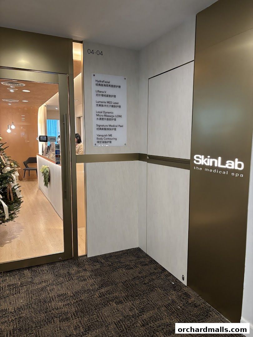 Entrance to SkinLab The Medical Spa with a list of services displayed.