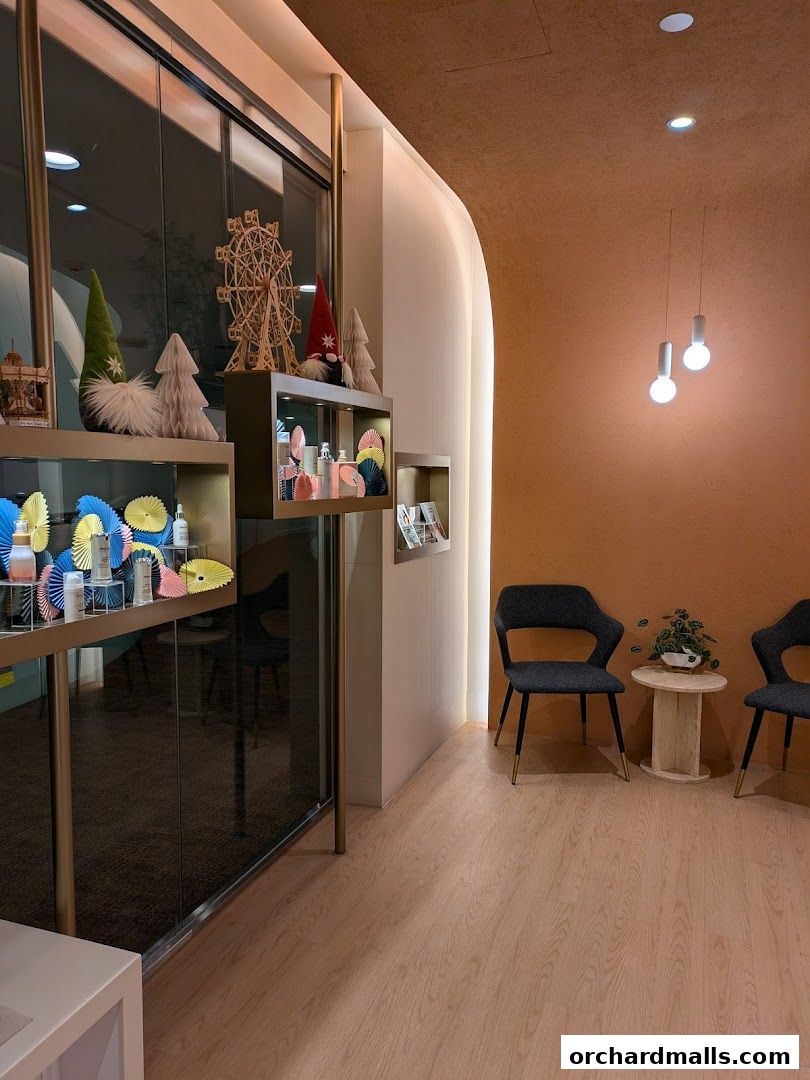 Interior of a medical spa with display shelves, seating area, and decorative elements.