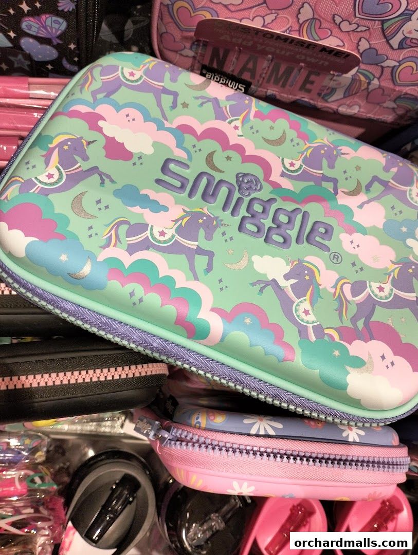 A collection of colorful Smiggle pencil cases and stationery items with unicorn and cloud designs.