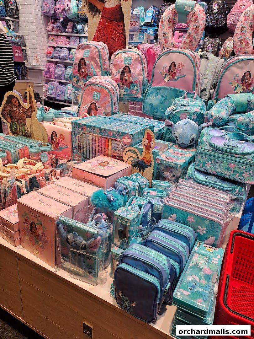 A vibrant display of Smiggle merchandise featuring Disney's Moana and Stitch characters.