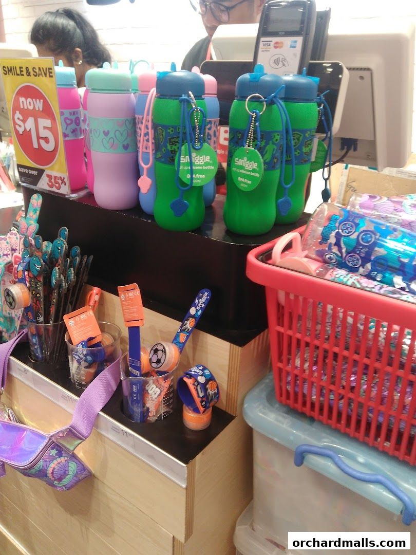 Smiggle shop display featuring colorful water bottles, stationery, and accessories.