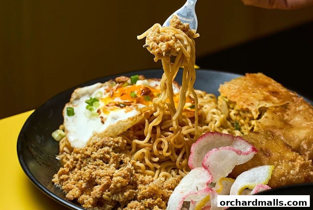 A close-up shot of a delicious noodle dish with a fried egg and crispy crackers.