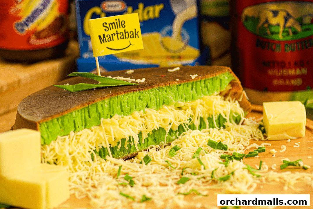 A close-up of a delicious martabak filled with cheese and pandan.