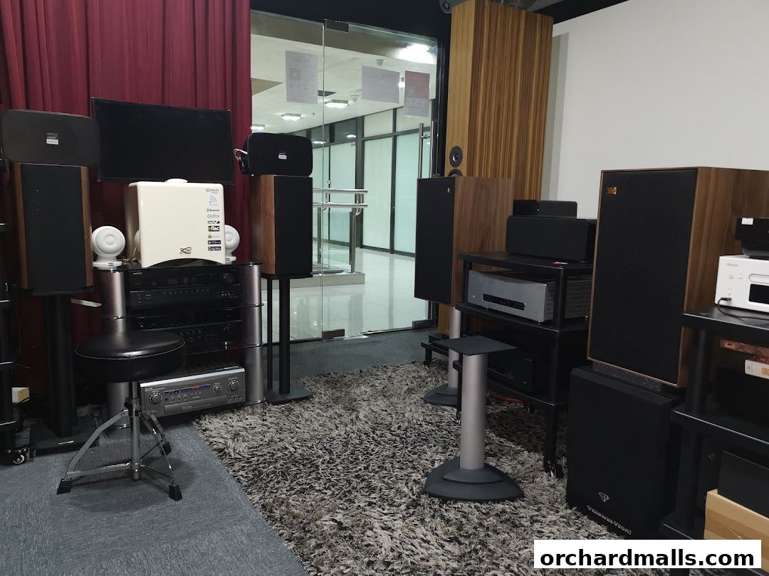 A retail space showcasing various high-fidelity audio equipment, including speakers and amplifiers.