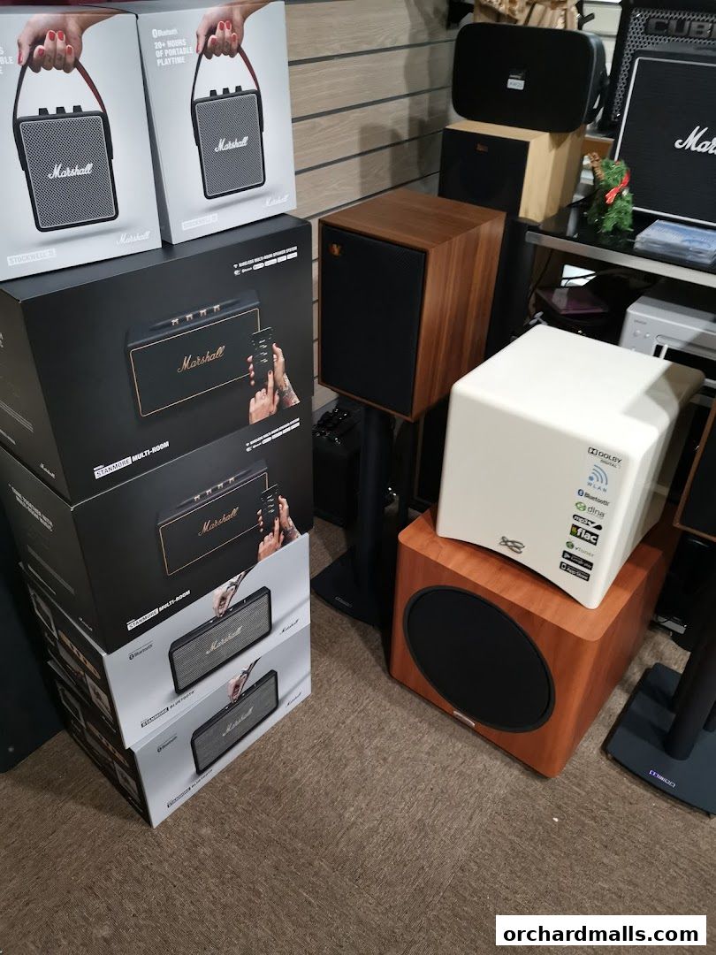 A display of Marshall audio equipment, including speakers and portable devices, in their boxes.