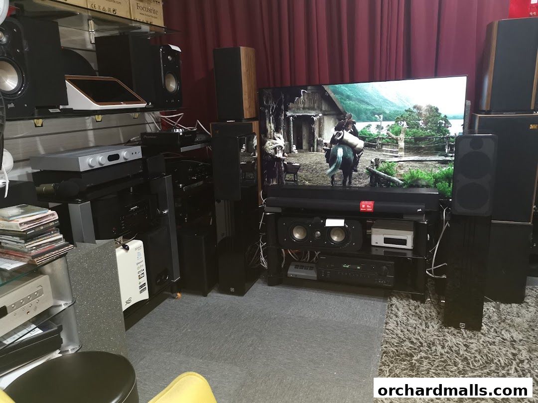 A display of high-fidelity audio equipment, including speakers and a large television.