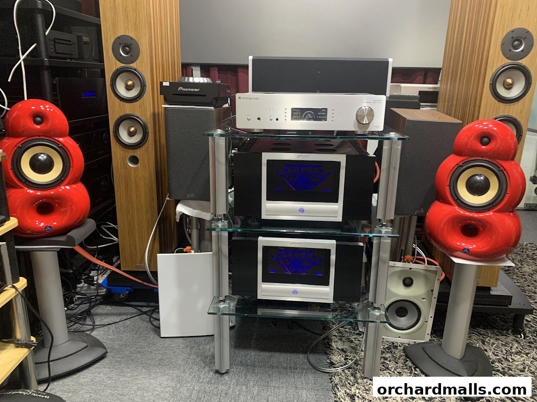 A display of high-fidelity audio equipment including speakers and amplifiers.