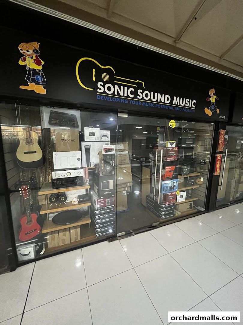 Exterior view of Sonic Sound Music shop showcasing guitars and audio equipment.