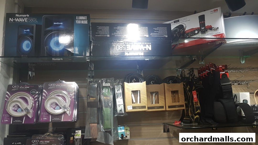 Shelves stocked with audio equipment, cables, and accessories at Sonic Sound Audio.