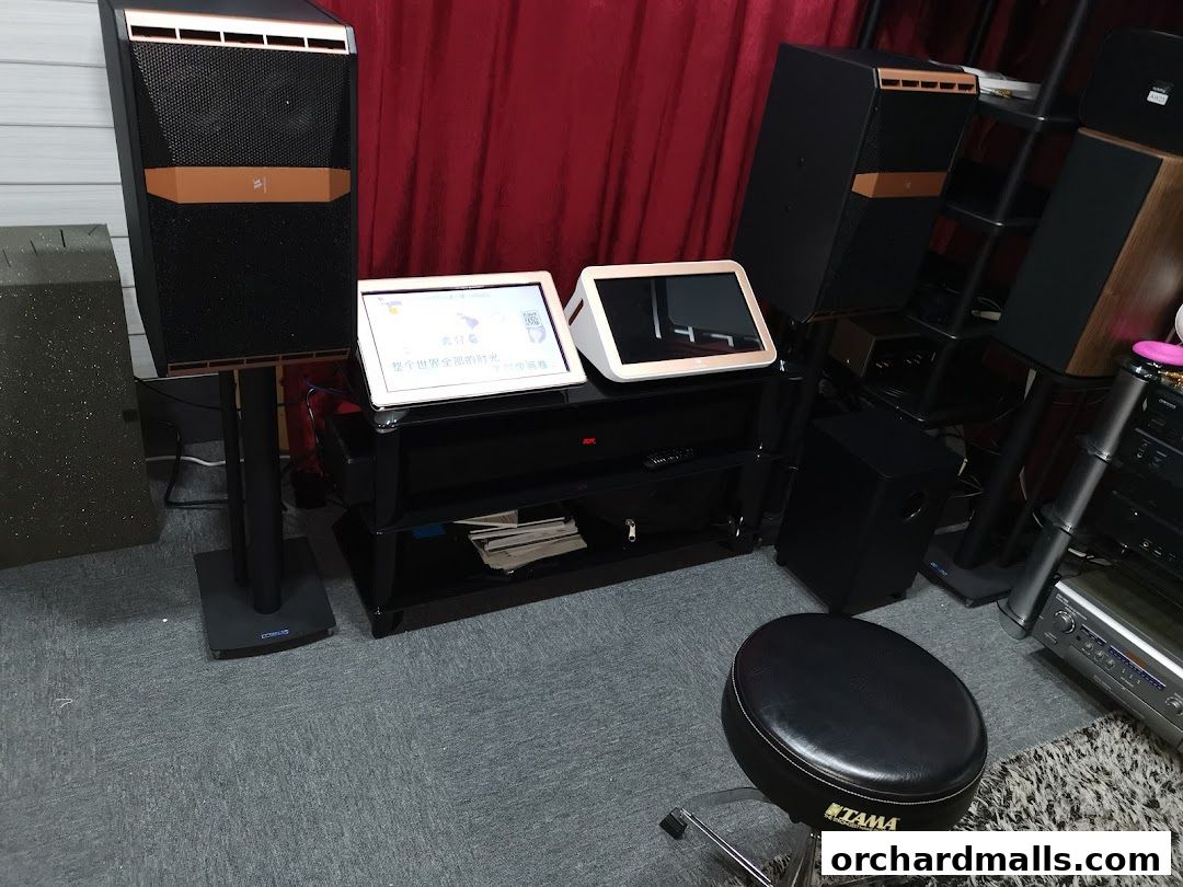 A display of high-fidelity audio equipment including speakers, subwoofers, and audio receivers.
