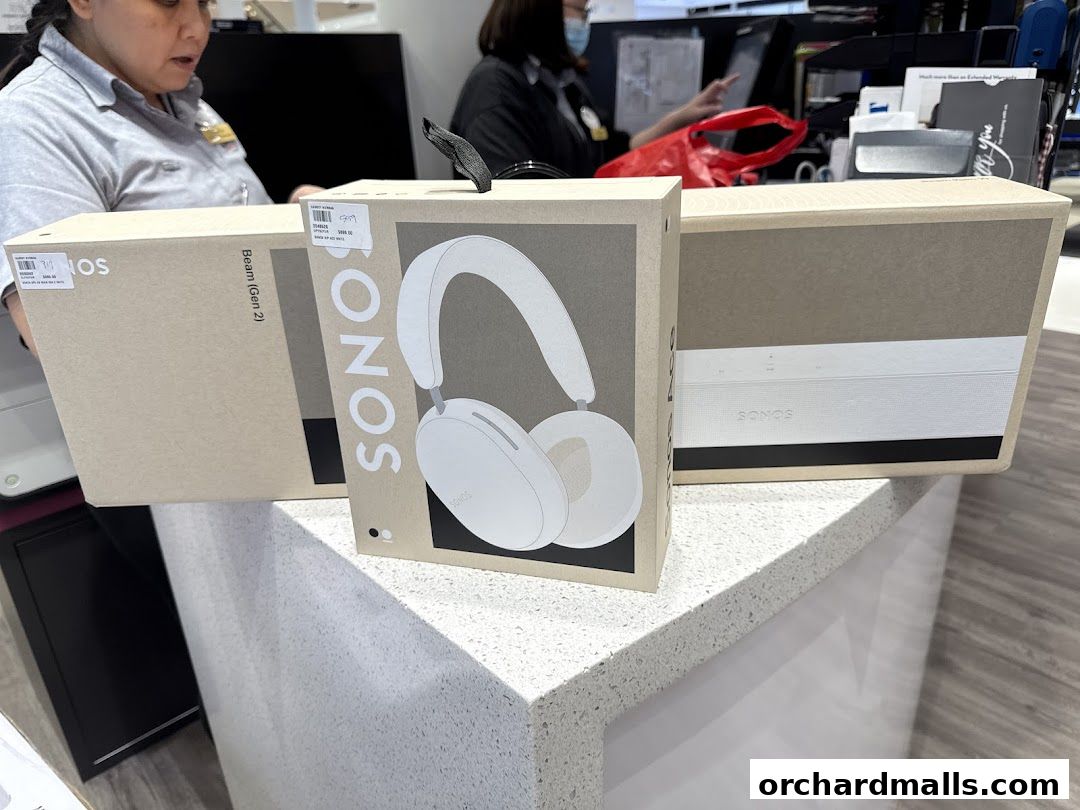 Sonos products, including headphones and soundbars, displayed in their packaging.
