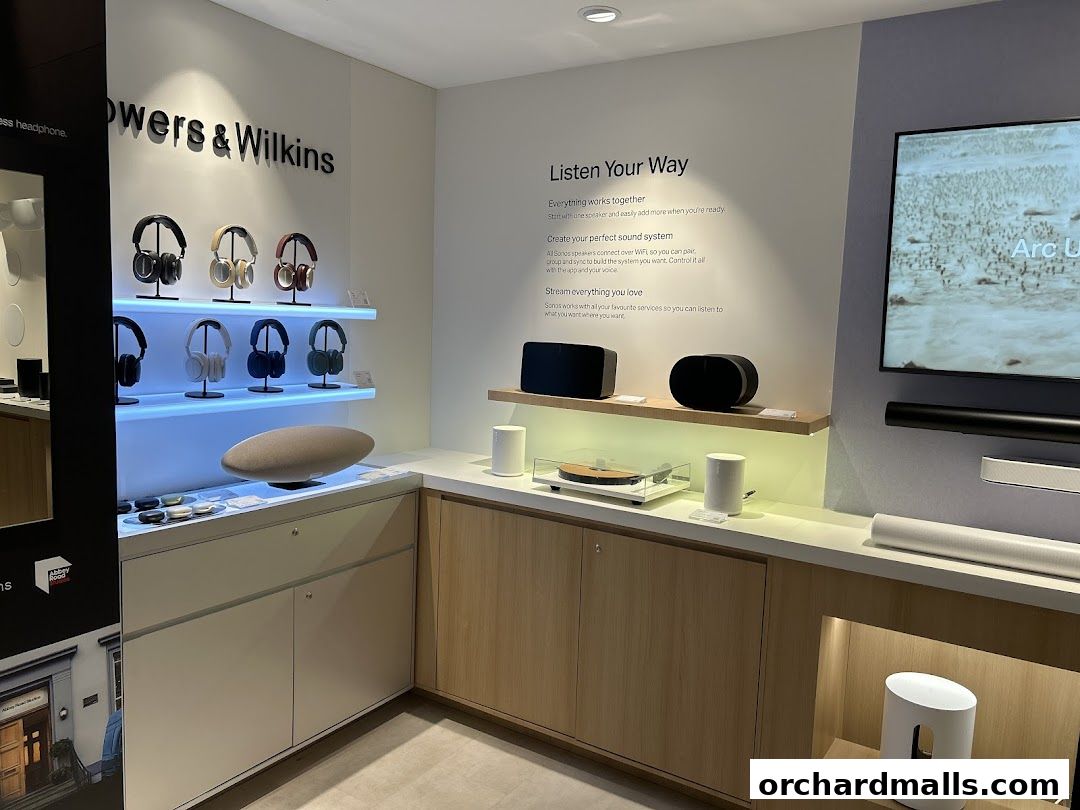 Interior view of a Sonos store showcasing headphones, speakers, and sound systems.