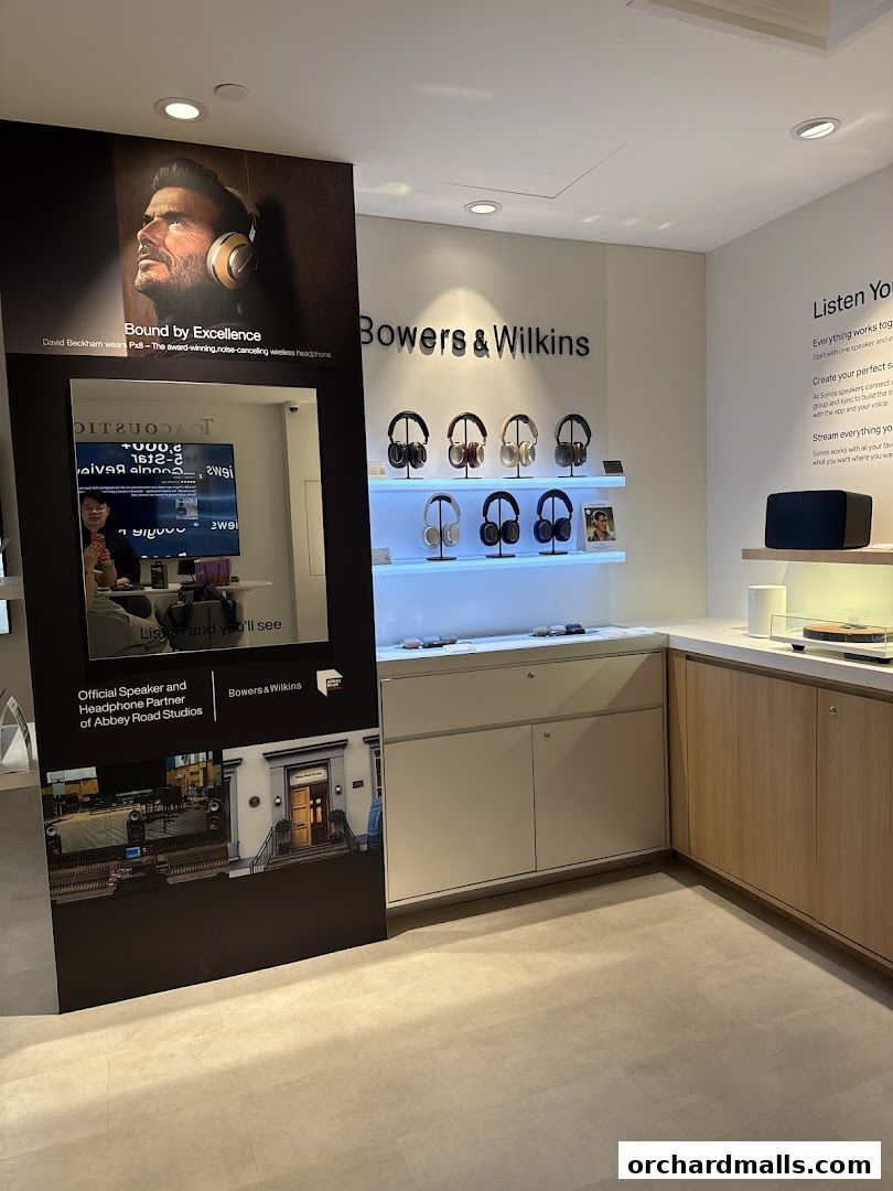 Interior of a Sonos store showcasing Bowers & Wilkins headphones and audio equipment.