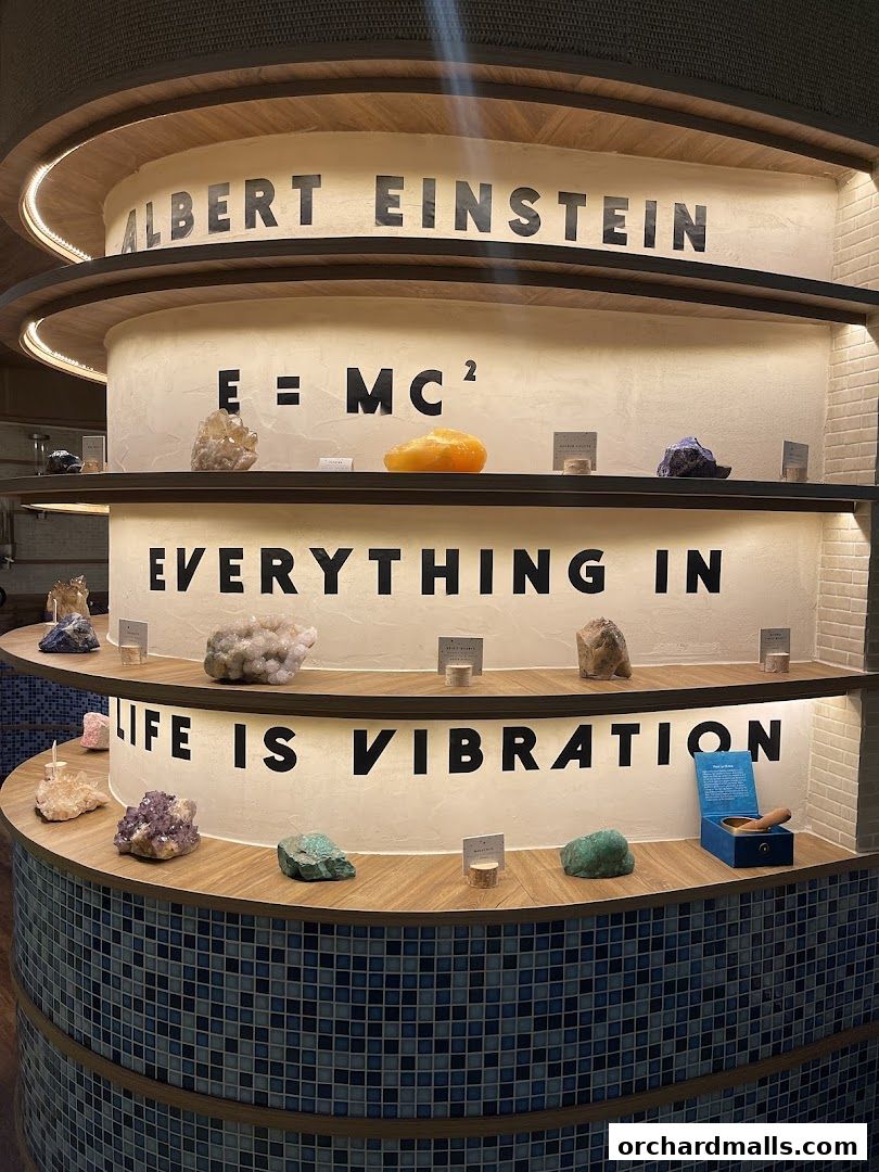 Display of crystals and scientific quotes, including Albert Einstein's famous equation.