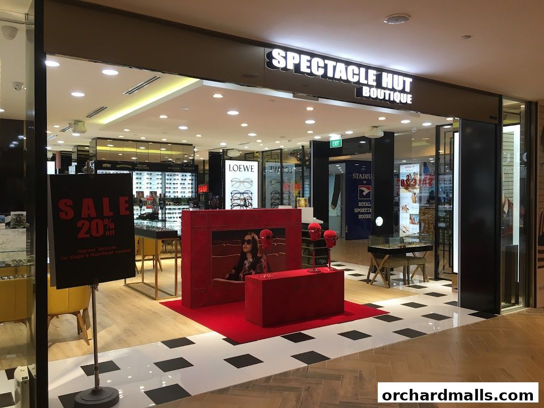 Spectacle Hut Boutique storefront with a sale sign and display of eyewear.