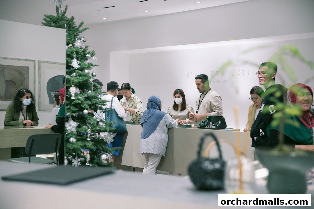 Customers interact with staff at a jewelry store during the holiday season.