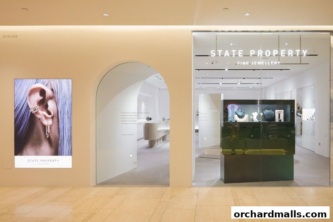Exterior view of State Property Fine Jewellery shop with a large advertisement and display cases.