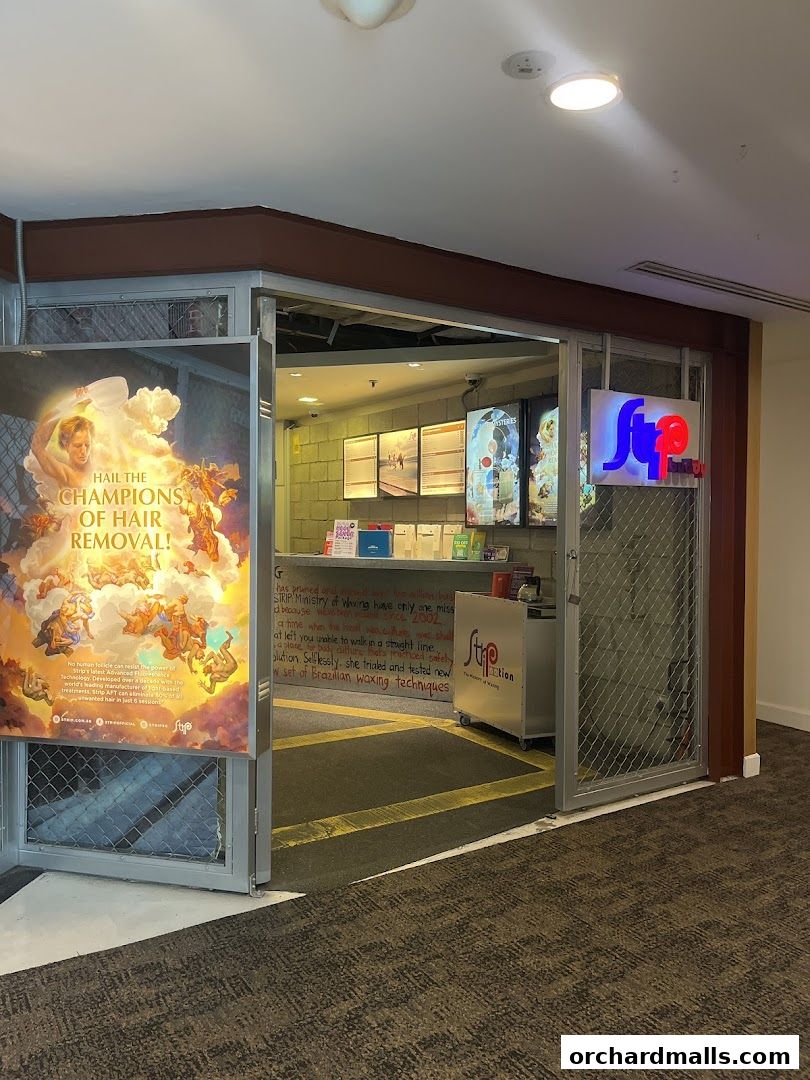 The entrance of Strip Co-Ed Wheelock, a hair removal salon, with promotional posters.