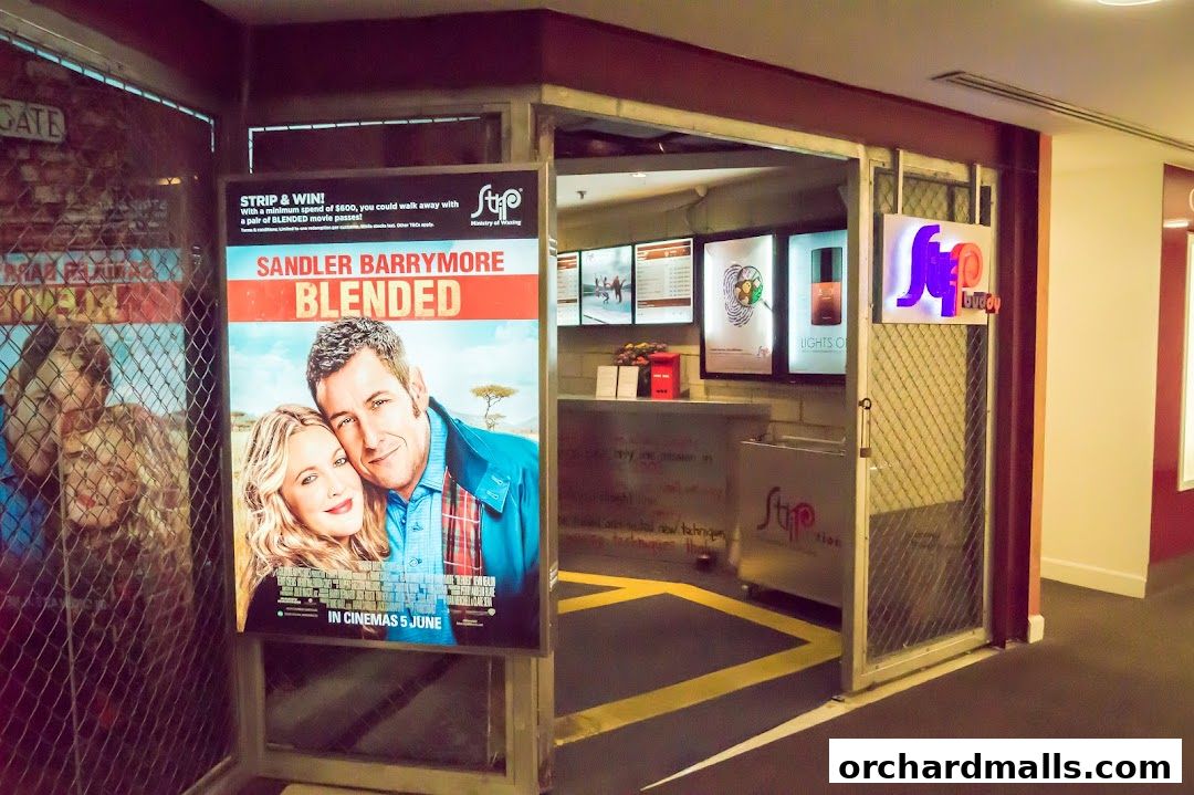Entrance to Strip Co-Ed Wheelock with movie poster and promotional displays.