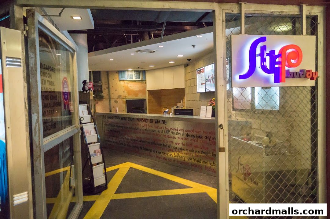 Entrance to Strip Co-Ed Wheelock, a waxing salon with a reception desk and signage.