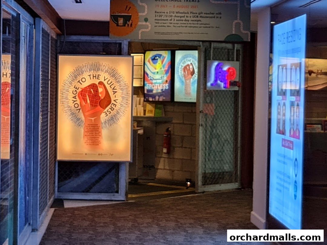 Entrance to Strip Co-Ed Wheelock with artistic posters and neon signage.