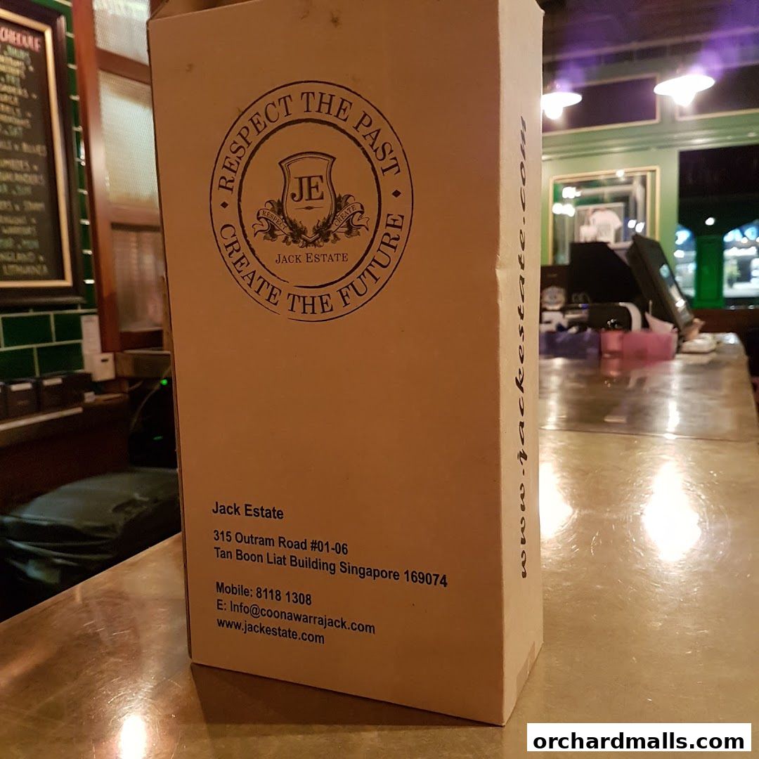 A cardboard box with Jack Estate branding and contact information.