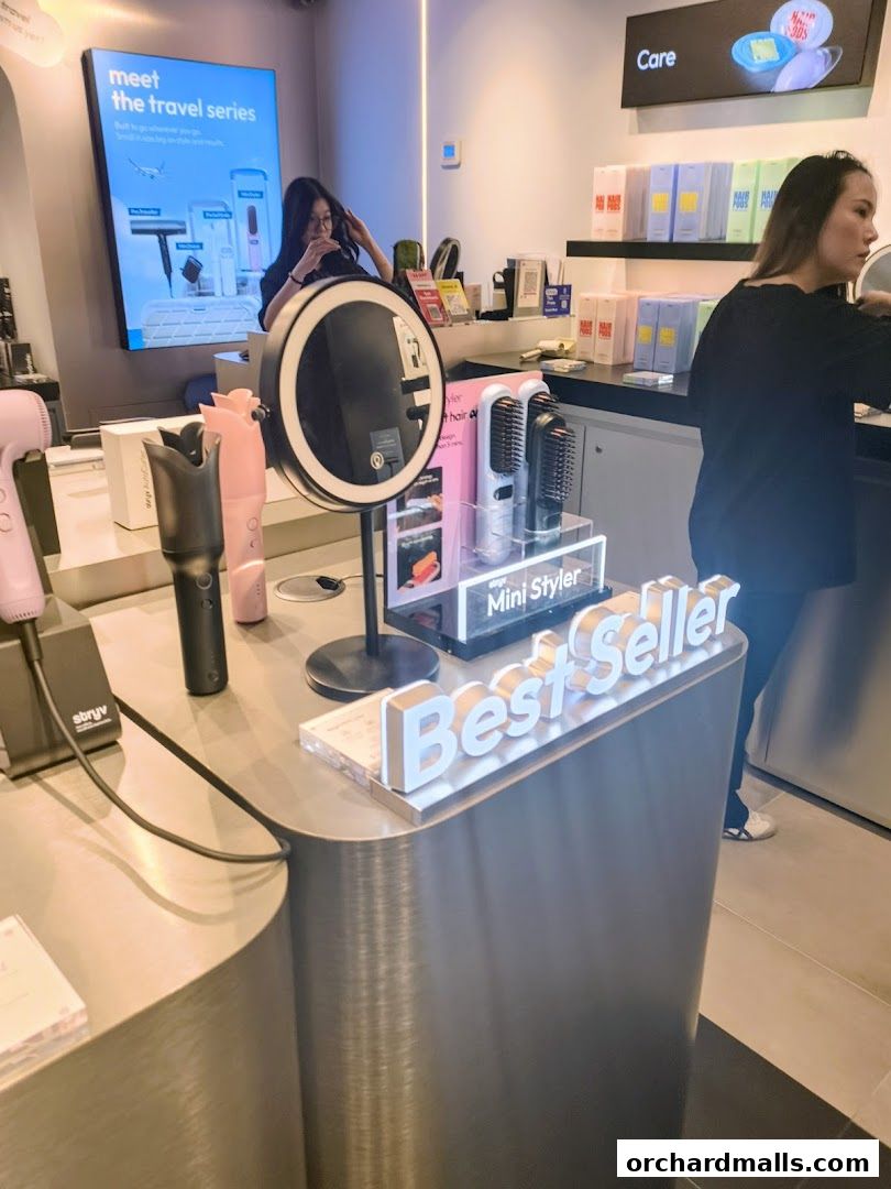 A retail shop interior showcasing hair styling products and a 'Best Seller' display.