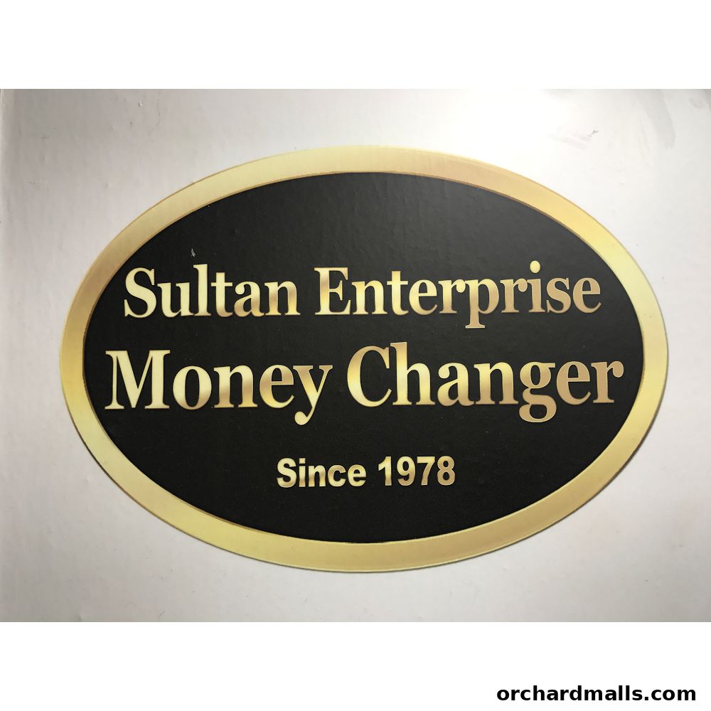 A sign for Sultan Enterprise Money Changer, established in 1978.