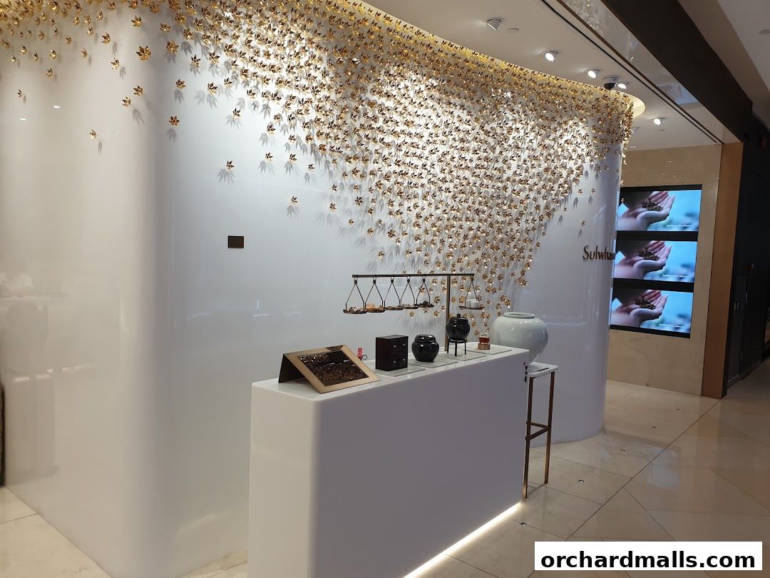 Sulwhasoo Boutique interior with elegant displays and digital screens showcasing products.